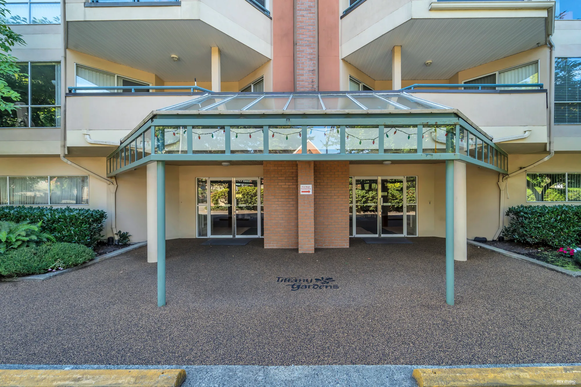 The glass-canopied entrance