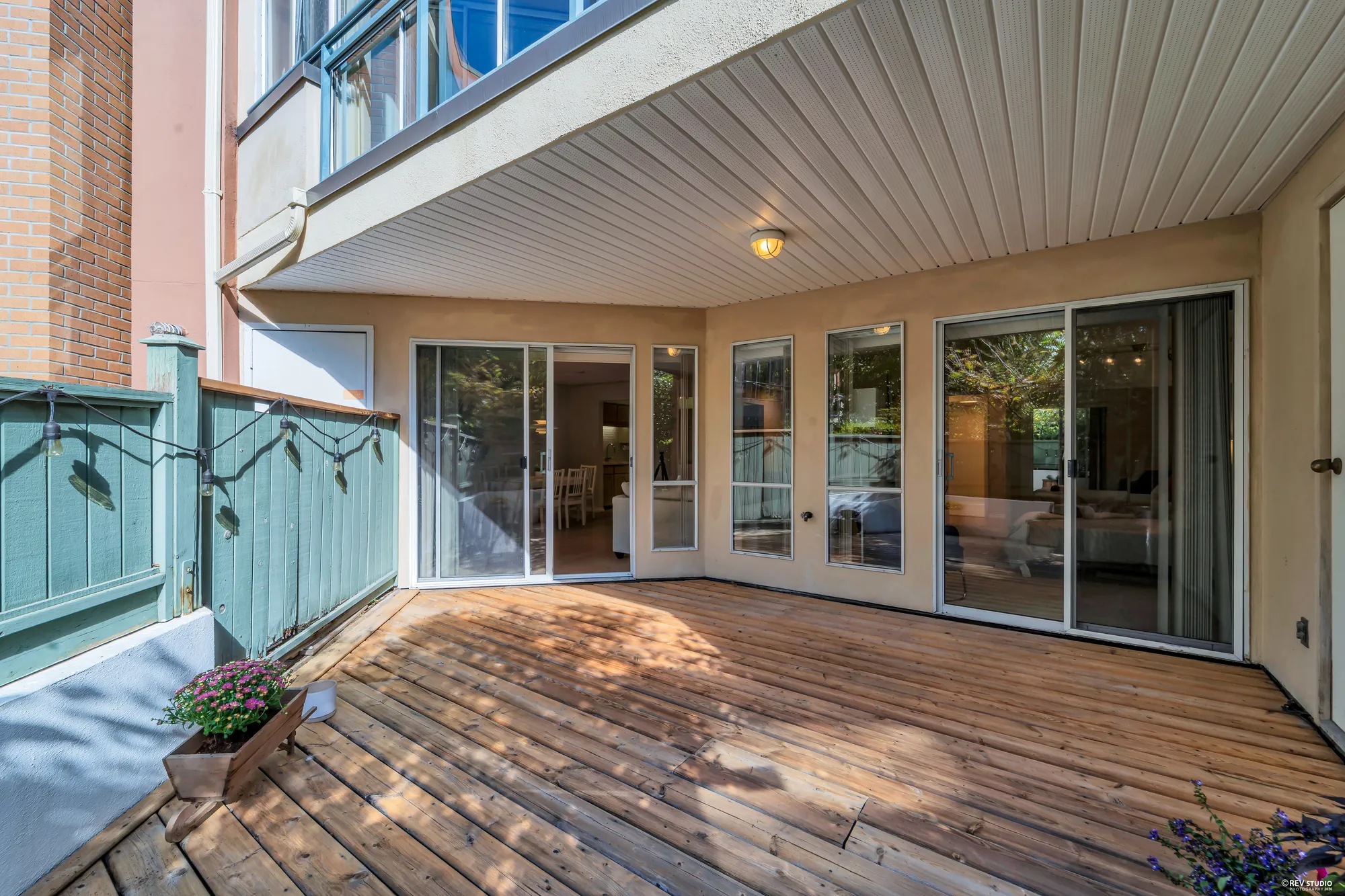 The covered part of the deck looking back at the sliding doors