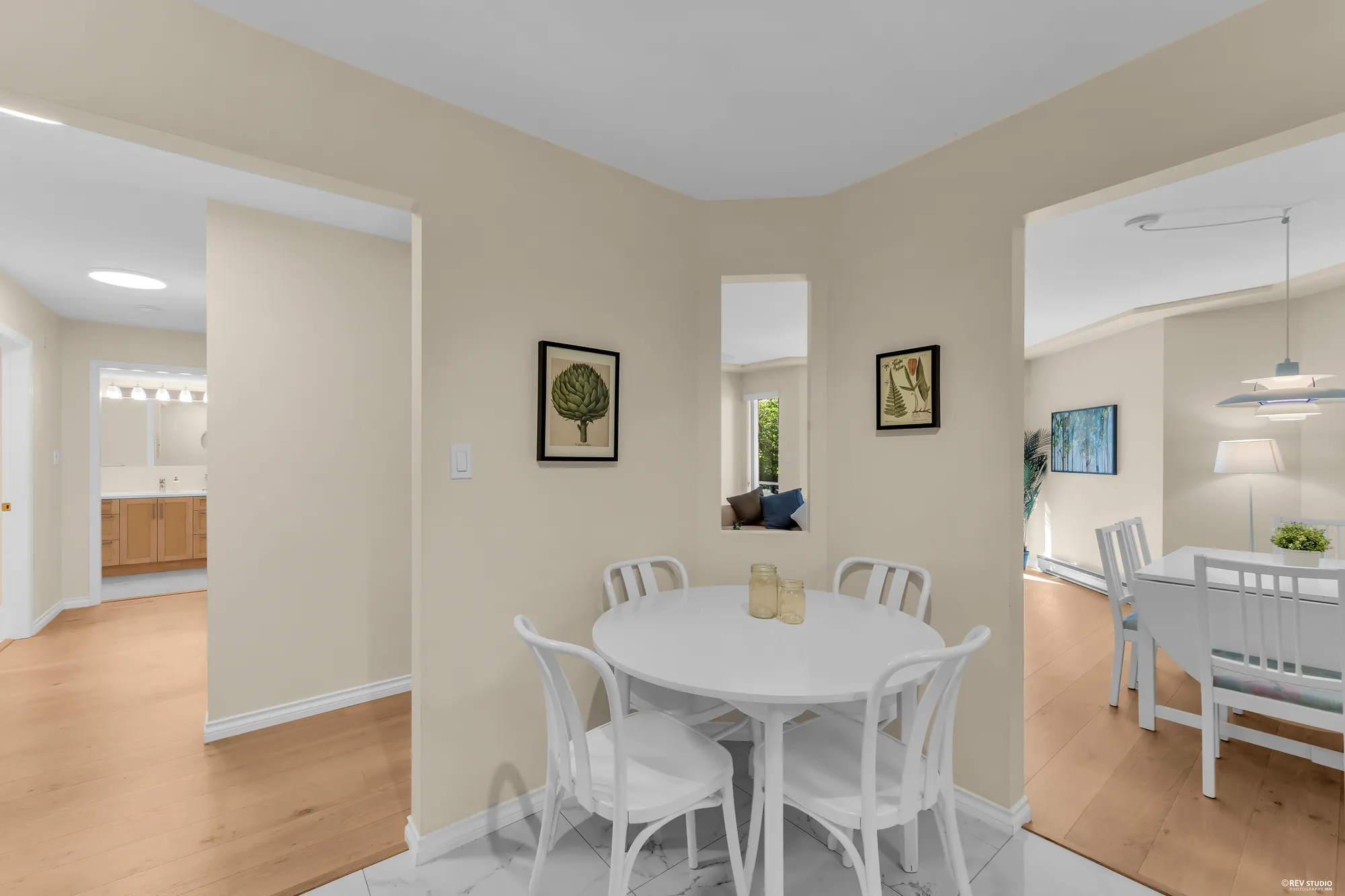 The hall toward the dining area, bathroom door at left